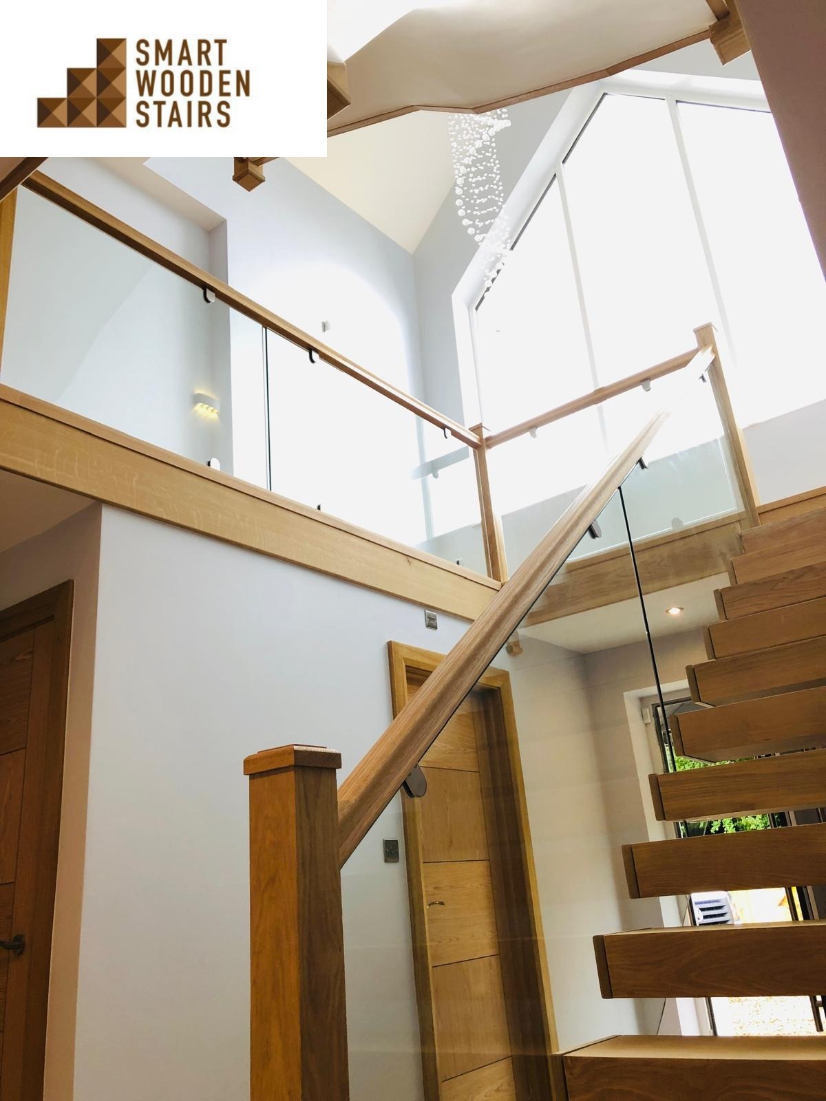 Oak floating staircase with glass